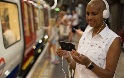 Woman using mobile phone at Westminster station