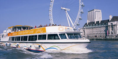 Boat trip on the Thames passing the London Eye